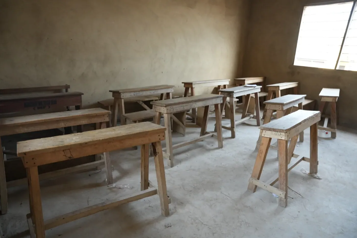 A renovated classroom with newly cemented walls and floors.